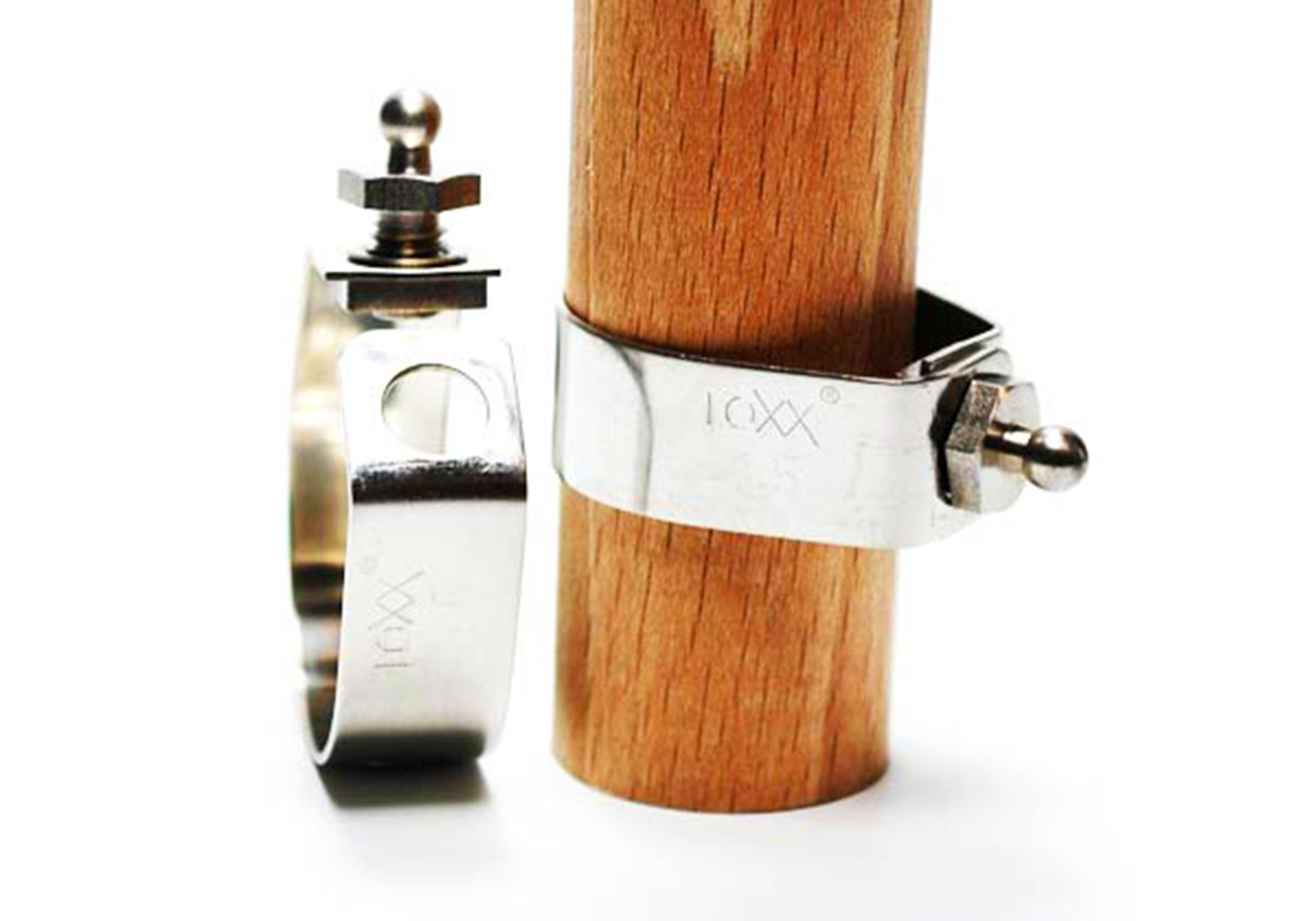 Loxx stainless steel strap clamps mounted on a wooden rod on white background